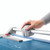 CW Office Dahle Professional Trimmer A4, close-up of a person using the paper trimmer with a cutting blade and adjustable guide on a white background.