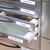 CW Office Dymo D1 Nylon Flex Tape 12MM BLK/WHT, black and white nylon flexible tape stored in a medical cabinet drawer.
