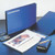 CW Office Esselte 4O Bndr 25MM PP Lcap A3 BLK, black A3 binder with ring pages and office supplies on a desk