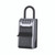 CW Office Master Lock Key Lock Box + Shackle, a silver and black combination lock box designed for secure key storage with a four-digit combination dial and a sturdy shackle.