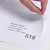 CW Office A4 Integrated Lab S18 164X120 PK1000, a hand peeling off a label from a stack of paper sheets with printed recipient details.