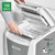 Leitz IQ Autofeed Cross-Cut P-4 Shredder, lifting lid to load confidential business report sheets in white office shredder.