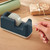 CW Office Leitz Cosy Tape Dispenser Tape GREY, a desk accessory used for dispensing adhesive tape in a neat and controlled manner.