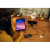 CW Office Verbatim GaN Wall Charger 65W 2 Port with Retractable Cable, black 65W wall charger and cable on a desk beside a tablet
