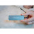CW Office Verbatim USB-C Essentials Multiport Hub 4 Port Hub HDMI, compact blue Verbatim USB-C hub held in a hand with its cable connected