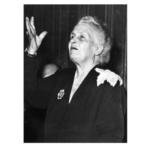 Maria Montessori giving a speech on photo paper