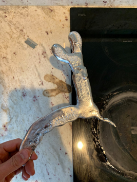 man holding melted metal