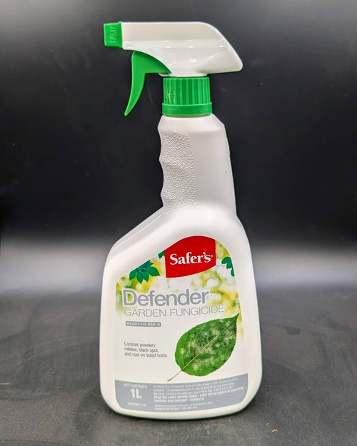 A 1-litre white and green plastic spray bottle of Safer’s® Defender Garden Sulphur, featuring a bright green trigger nozzle and label with product name and images of healthy garden plants.
