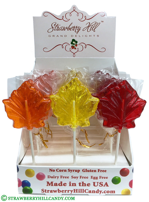 Assorted Fall Leaf Hard Candy Lollipops. Red Strawberry, Yellow Lemon, Orange Orange in 25 Count Display. Made with natural colors.