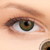 3 T Festival Green Contact Lenses shown on grey eyes