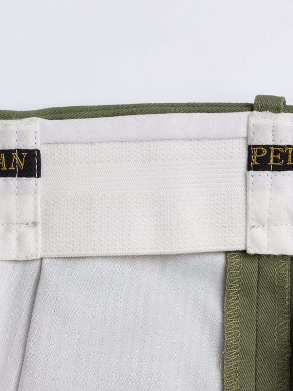 Close Up of Green Pleated Chino Trousers Expanding Waistband