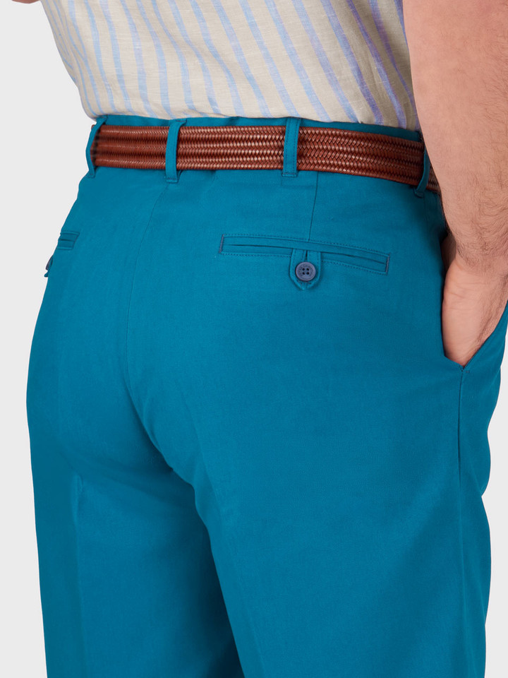 Model wears Men's Royal Blue Cotton Pleated Chino Shorts Back Pocket