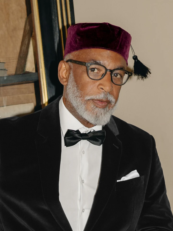 Model wears Men's Burgundy Red Velvet Tasselled Smoking Cap