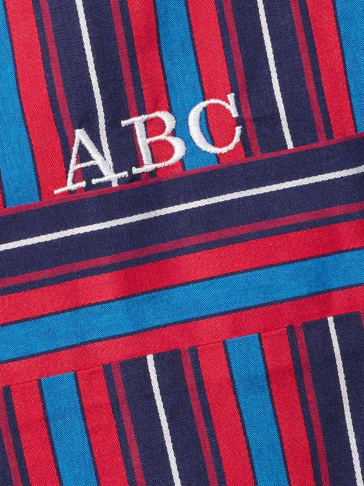Close Up of Navy & Red Club Striped cotton Pyjamas monogrammed