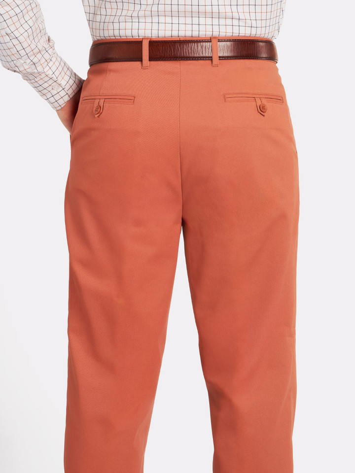 Terracotta pleated chinos