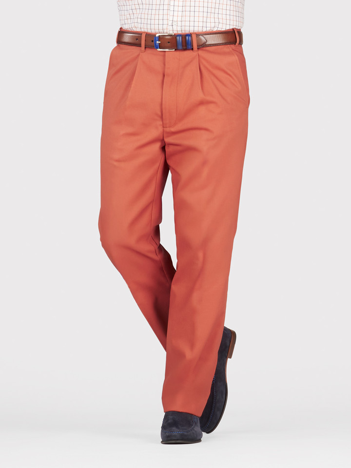 Mens Terracotta Pleated Chino Trousers on Model Legs
