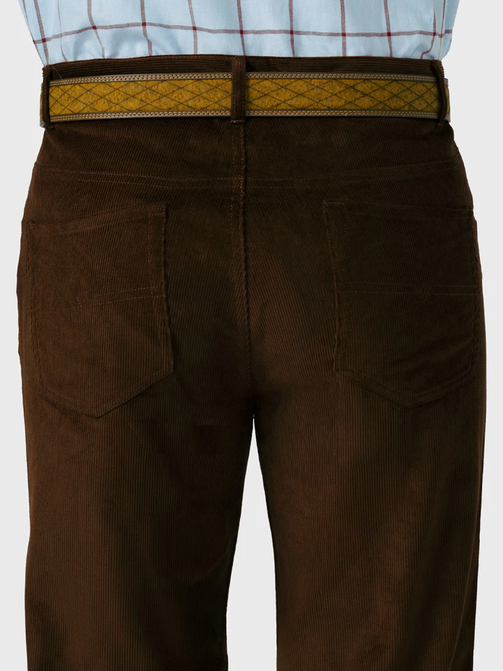 Model wears Mens Cocoa Needle Cord Jeans Back Pockets
