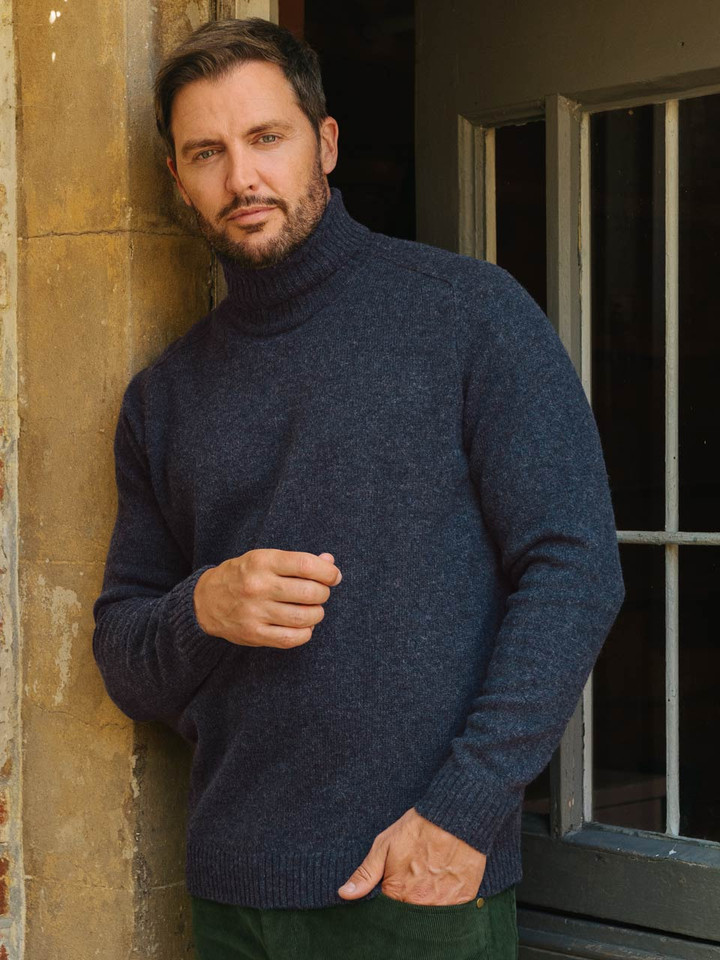 Mens Navy Blue Lambswool Roll Neck Jumper on Model