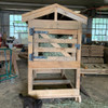 horse feeder featuring a roof and access doors