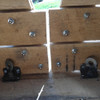covered round bale feeder doors with latches