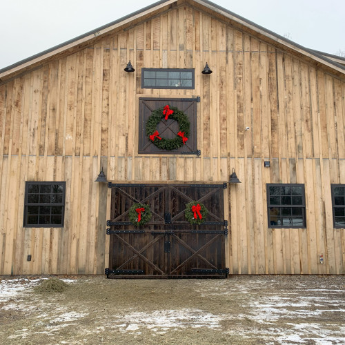 barn with board and batten siding and swinging barn doors