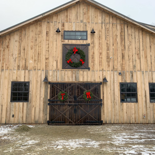 board and batten barn with large split barn doors