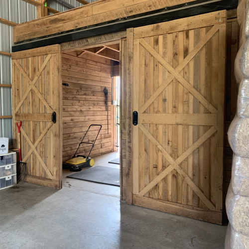 two sliding barn doors in board & batten