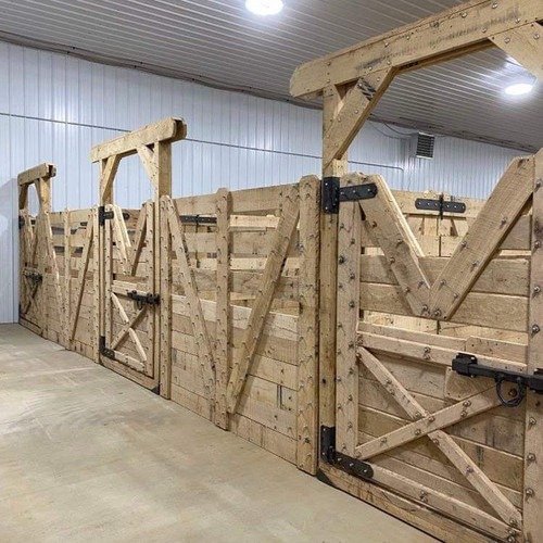 wooden horse stalls with partitions