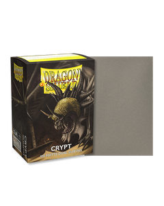 Dragon shield box featuring art of a large grey dragon in a crypt. To the right of the box is a sample sleeve showcasing the color. Dragon shield box featuring art of a large grey dragon in a crypt. To the right of the box is a sample sleeve showcasing the color.