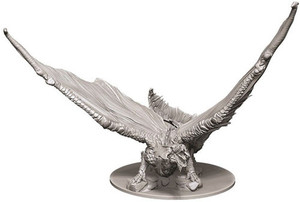 An unpainted Young Brass Dragon miniatures on a white background. An unpainted Young Brass Dragon miniatures on a white background.