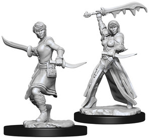 Two unpainted Female Human Rogues on a white background. Two unpainted Female Human Rogues on a white background.