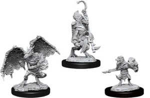 Three unpainted Kobold miniatures on a white background. Three unpainted Kobold miniatures on a white background.