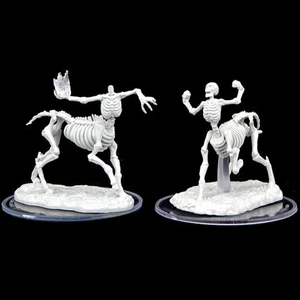 Two unpainted skeletal centaur miniatures on a black background. One of them is headless and holding a fireball.
