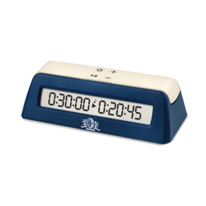 A digital chess clock with two large, white buttons, a dark blue case, four smaller buttons that display a power symbol, plus and minus, and a combined pause and play button.  The digital display has large numerals and central symbols for play and a music note.
