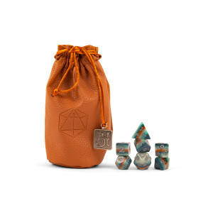 Light brown leather-like bag with an embossed Critical Role logo and a Bells Hells charm. To the right of the bag are a set of 7 dice multicolored in wavy shades of green, grey, and gold with cool grey numbering. Light brown leather-like bag with an embossed Critical Role logo and a Bells Hells charm. To the right of the bag are a set of 7 dice multicolored in wavy shades of green, grey, and gold with cool grey numbering.