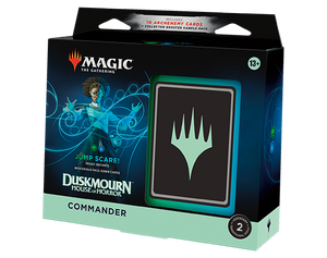 A blue and green Magic the Gathering Commander deck titled “Jump Scare!” From the set Duskmourn: House of Horrors. The art on the cover depicts a dark-skinned person with long, tightly curled hair held back by a headband. They wear a pair of goggles, a white and black, long-sleeved robe, and a scientific instrument of some kind strapped to their hip. Around them blue, swirly designs like a Mandelbrot set. The rest of the box is black and blue with a strip of pale green on the bottom. In that strip is the word “Commander” in black letters. A blue and green Magic the Gathering Commander deck titled “Jump Scare!” From the set Duskmourn: House of Horrors. The art on the cover depicts a dark-skinned person with long, tightly curled hair held back by a headband. They wear a pair of goggles, a white and black, long-sleeved robe, and a scientific instrument of some kind strapped to their hip. Around them blue, swirly designs like a Mandelbrot set. The rest of the box is black and blue with a strip of pale green on the bottom. In that strip is the word “Commander” in black letters.