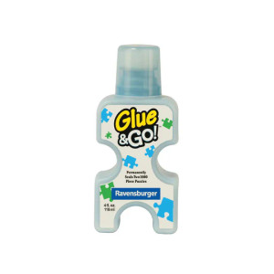 A light blue and white bottle of glue titled "Glue & Go!" with puzzle pieces floating around the label. The bottle is shaped like a jigsaw puzzle piece. A light blue and white bottle of glue titled "Glue & Go!" with puzzle pieces floating around the label. The bottle is shaped like a jigsaw puzzle piece.