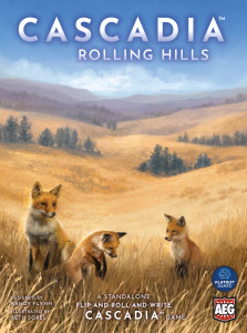 A board game titled “Cascadia: Rolling Hills” in large font at the top of the box. The cover features a yellow grassland on rolling hills with a few lone evergreen trees in the distance. In the foreground are three red foxes, two of which are sitting and looking in different directions and one of which is mid pounce. A board game titled “Cascadia: Rolling Hills” in large font at the top of the box. The cover features a yellow grassland on rolling hills with a few lone evergreen trees in the distance. In the foreground are three red foxes, two of which are sitting and looking in different directions and one of which is mid pounce.