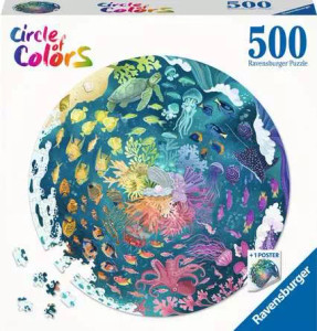 A puzzle with the tagline “Circle of Colors” in a rainbow gradient in the upper left corner of the cover.  The background of the box is white, and in the center is an image of the finished puzzle: a rainbow circle featuring schools of fish and various ocean creatures swimming through blue water, each arranged in ROYGBIV order around a central cluster of coral.  A turtle, stingray, and octopus float around the edges, and waves crash by the border.