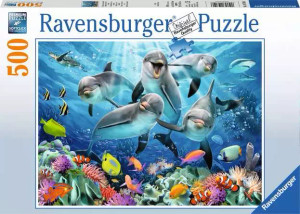 A puzzle with the words “Ravensburger Puzzle” at the top and the number ‘500’ along the left side of the white bordered cover. Below is an image of the finished puzzle, which features a pod of five grey, bottlenose dolphins swimming around each other in bright blue water. Below them is a vibrant coral reef with tropical fish. A puzzle with the words “Ravensburger Puzzle” at the top and the number ‘500’ along the left side of the white bordered cover. Below is an image of the finished puzzle, which features a pod of five grey, bottlenose dolphins swimming around each other in bright blue water. Below them is a vibrant coral reef with tropical fish.