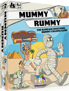 A board game titled "Mummy Rummy" in strips of cloth at the top of the cover. Below is a cartoon drawing of a mummified person escaping a pale man dressed as a pharaoh as they both run across a sandy landscape away from a distant pair of pyramids. The man is holding an empty sarcophagus above his head and has a rather irate facial expression. A board game titled "Mummy Rummy" in strips of cloth at the top of the cover. Below is a cartoon drawing of a mummified person escaping a pale man dressed as a pharaoh as they both run across a sandy landscape away from a distant pair of pyramids. The man is holding an empty sarcophagus above his head and has a rather irate facial expression.