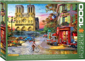 The image is a puzzle box featuring a colorful illustration of a Parisian street scene at sunset. The iconic Notre Dame Cathedral is prominently featured, with its detailed Gothic architecture and large rose window illuminated by a warm golden light. The title, "Notre Dame Sunset" is printed in white text on green background along the bottom edge. On the right hand side, the company logo reads "EUROGRAPHICS PUZZLES" and the number ‘1000’ after it indicates the puzzle piece count. The image is a puzzle box featuring a colorful illustration of a Parisian street scene at sunset. The iconic Notre Dame Cathedral is prominently featured, with its detailed Gothic architecture and large rose window illuminated by a warm golden light. The title, "Notre Dame Sunset" is printed in white text on green background along the bottom edge. On the right hand side, the company logo reads "EUROGRAPHICS PUZZLES" and the number ‘1000’ after it indicates the puzzle piece count.