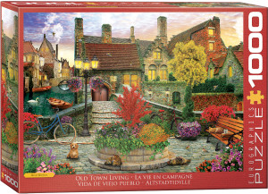 The image is a puzzle box featuring a picturesque old town setting. In the foreground, there is a cobblestone path bordered with colorful flowers and lush greenery. A charming bench, an old-fashioned lamppost adorned with hanging flower baskets, and a bright blue bicycle lean against the stone wall. A small dog and a cat rest near the flower beds, adding warmth to the scene. The title, "Old Town Living" is printed in white text on a red background along the bottom edge. On the right hand side, the company logo reads "EUROGRAPHICS PUZZLES" and the number ‘1000’ after it indicates the puzzle piece count. The image is a puzzle box featuring a picturesque old town setting. In the foreground, there is a cobblestone path bordered with colorful flowers and lush greenery. A charming bench, an old-fashioned lamppost adorned with hanging flower baskets, and a bright blue bicycle lean against the stone wall. A small dog and a cat rest near the flower beds, adding warmth to the scene. The title, "Old Town Living" is printed in white text on a red background along the bottom edge. On the right hand side, the company logo reads "EUROGRAPHICS PUZZLES" and the number ‘1000’ after it indicates the puzzle piece count.