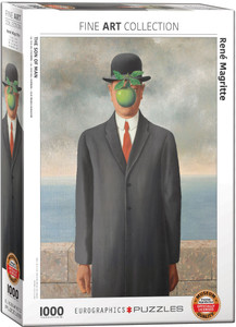 The image shows a puzzle box featuring the piece “Son of Man” by René Magritte. The artwork shows a man in a black suit and bowler hat standing in front of a low wall, with a cloudy sky visible behind him. An apple obscures the man's face, hanging in mid-air, with a few leaves attached. Along the top is printed the collection name, “Fine Arts.” The bottom left has the number '1000' indicating the number of pieces in the puzzle. Along the bottom edge, the company logo reads "EUROGRAPHICS PUZZLES."  A blue badge in the lower right corner indicates the puzzle is an officially licensed reproduction of museum quality.