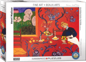 The image shows a puzzle box featuring the piece “The Desert: Harmony in Red” by Henri Matisse. The image showcases a vibrant room dominated by rich red walls with intricate blue floral patterns. In the foreground, a table is set with a variety of fruits and bottles, emitting a sense of domestic life. A woman, dressed in a dark blue attire, is seen arranging fruit in a bowl. The background reveals a window view, displaying vivid greenery and an impressionistic sky, with stylized trees in bloom. Along the top is printed the collection name, “Fine Arts.” The bottom left has the number '1000' indicating the number of pieces in the puzzle. Along the bottom edge, the company logo reads "EUROGRAPHICS PUZZLES." A blue badge in the lower right corner indicates the puzzle is an officially licensed reproduction of museum quality. The image shows a puzzle box featuring the piece “The Desert: Harmony in Red” by Henri Matisse. The image showcases a vibrant room dominated by rich red walls with intricate blue floral patterns. In the foreground, a table is set with a variety of fruits and bottles, emitting a sense of domestic life. A woman, dressed in a dark blue attire, is seen arranging fruit in a bowl. The background reveals a window view, displaying vivid greenery and an impressionistic sky, with stylized trees in bloom. Along the top is printed the collection name, “Fine Arts.” The bottom left has the number '1000' indicating the number of pieces in the puzzle. Along the bottom edge, the company logo reads "EUROGRAPHICS PUZZLES." A blue badge in the lower right corner indicates the puzzle is an officially licensed reproduction of museum quality.