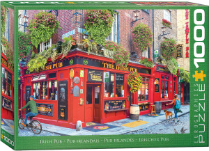 The image is a puzzle box that features a colorful scene of an Irish pub on a vibrant street corner. The pub exterior is painted in vivid red, with "The Irish Pub" written prominently above the entrance. Surrounding the building are lush, cascading hanging plants, adding a touch of greenery against the brick facade. The windows display traditional Irish decor, and there are various signs and plaques along the walls. A man in a green sweater rides past on a bicycle, while on the right side, a woman walks a dog on a cobblestone path. The pub showcases a cozy, welcoming atmosphere with barrels and signs indicating live music. The title, "Irish Pub" is printed along the bottom edge in white text on green background. On the right hand edge, the company logo reads "EUROGRAPHICS PUZZLES" and the number ‘1000’ after it indicates the puzzle piece count.