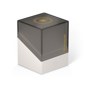 A card deck box with a semi-transparent black upper half with a satin finish, a solid white lower half, a golden emblem featuring a spiky and ornate sun on top, and Magic: The Gathering’s logo along the front right side.