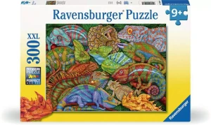 A puzzle with the words “Ravensburger Puzzle” at the top and the number ‘300’ along the left side of the cover.  Beside it is a puzzle piece with ‘XL’ inside.  Below is an image of the finished puzzle, which features a painting of a group of several different species of colorful reptiles.  At least three are different species of chameleon.