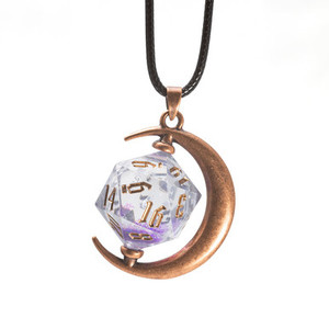 A coppery, moon-shaped necklace on a leather strap that holds a transparent 20-sided die.  Inside are glittery inclusions that float about within the liquid core.  The setting hangs from a black leather strap.
