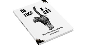 An RPG titled "Be Like a Cat" with a stylized drawing of a black cat in the center of the white cover.